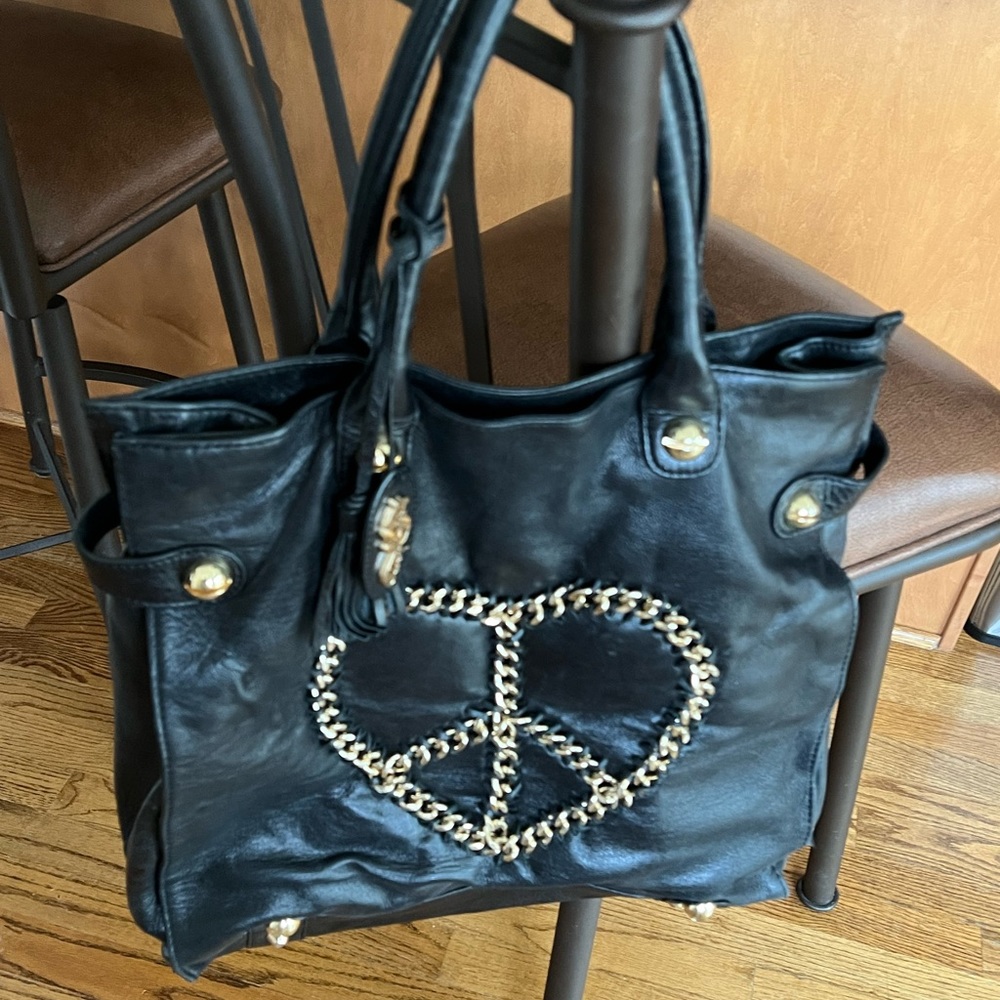 Luxury leather handbag, cool gold chain accents with heart/peace detail